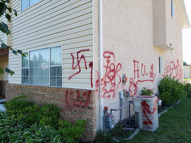 Harish Anand took this photo of the racist graffiti on his aunt and uncle's home in Summerland earlier this week.