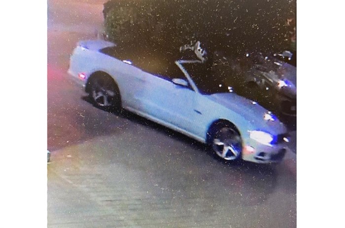 Kelowna RCMP say the white Ford Mustang pictured in this image from video surveillance at an area hotel is associated to an unidentified male seen with a missing 14-year-old, who has since been located.