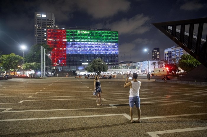 Tel Aviv City Hall is lit up with the flags of the United Arab Emirates and Israel as the countries announced they would be establishing full diplomatic ties, in Tel Aviv, Israel, Thursday, Aug. 13, 2020. In a nationally broadcast statement, Prime Minister Benjamin Netanyahu said the 