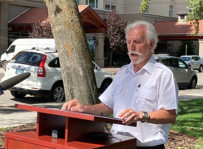 Penticton Mayor John Vassilaki spears to reporters at a press conference Aug. 19 to update the community about the Christie Mountain wildfire.
