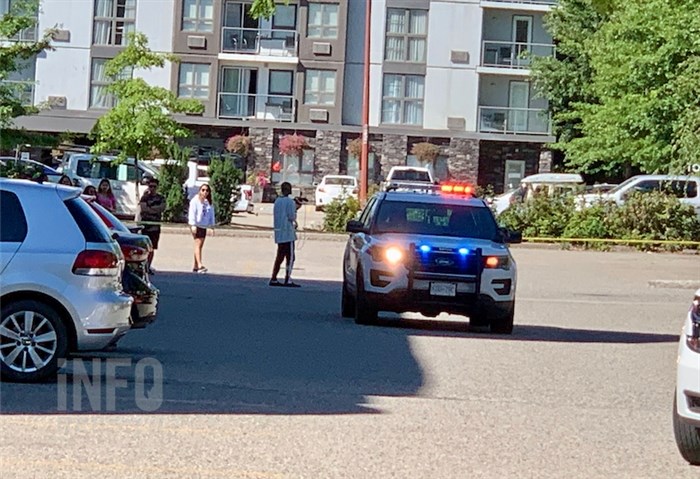 An RCMP cruiser is seen near the Ramada by Wyndham on Harvey Avenue in Kelowna, Wednesday, Aug. 26, 2020 as officer investigate a shots fired complaint.