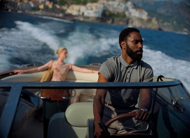 This image released by Warner Bros. Entertainment shows Elizabeth Debicki, left, and John David Washington in a scene from 