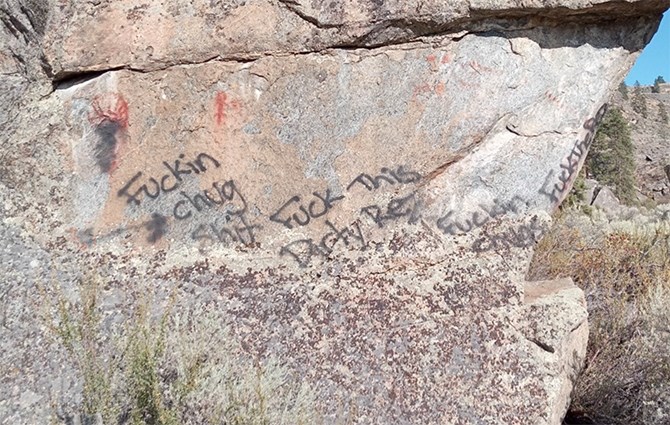 Osoyoos Indian Band Chief Clarence Louie lashed out at those responsible for defacing native pictographs with racist graffiti. 