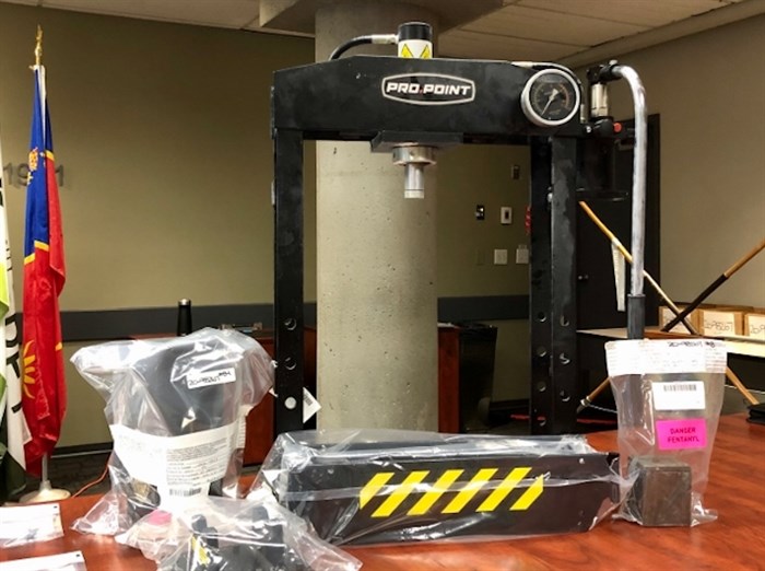 A drug brick press is seen among other items seized by Surrey RCMP, Aug. 20. 2020.