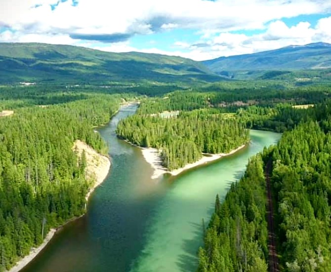 The light green coloured river is the North Thompson, originating from the Thompson Glacier. The darker water is the Clearwater River, which flows through Hobson Lake. 