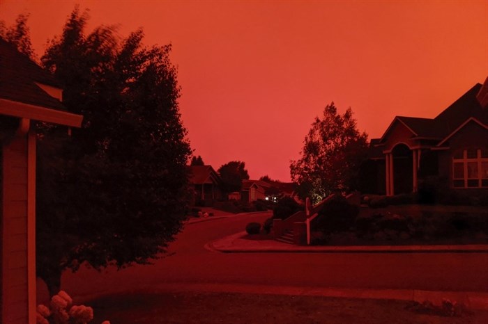 This photo taken from the home of Russ Casler in Salem, Ore., shows the smoke-darkened sky well before sunset, around 5 p.m., Tuesday, Sept. 8, 2020.