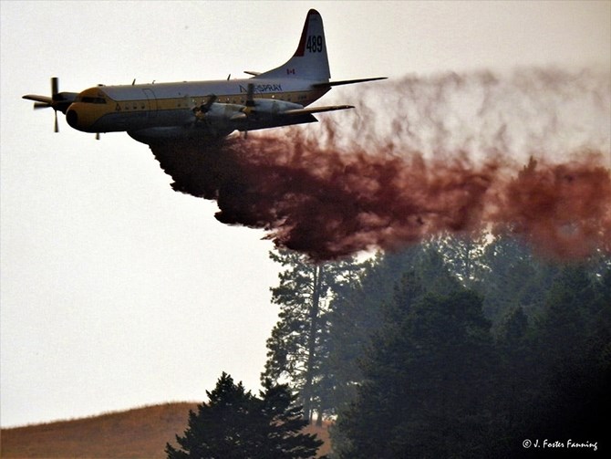 A B.C. wildfire air tanker working the Customs Road wildfire in Washington earlier this week. The air tanker came to the rescue of Ferry County residents Boddy and Cindy Poirer, saving their cabin from the flames.