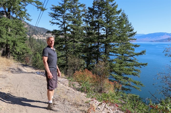 Bob Fleming, North Okanagan Regional District director for Electoral Area B, is pictured standing at an entrance to the Kal Crystal Waters Trail off of Crystal Waters Road.