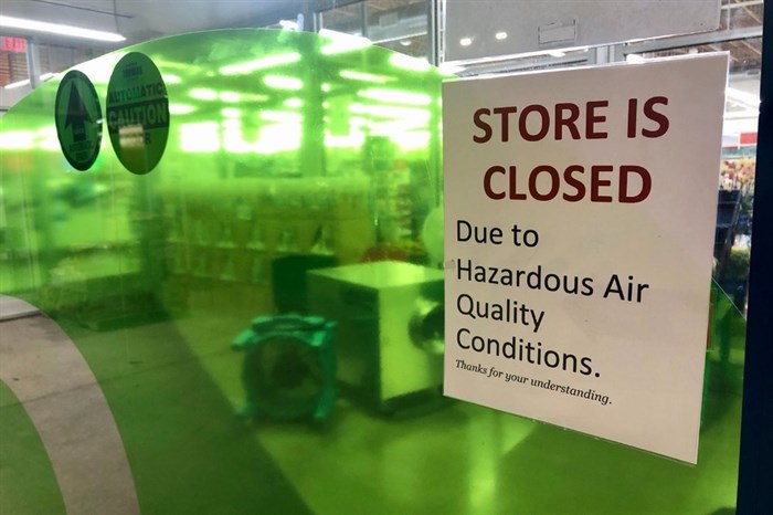 A sign at a Whole Foods in Lake Oswego, Ore., advises that the store is closed due to poor air quality Monday, Sept. 14, 2020.