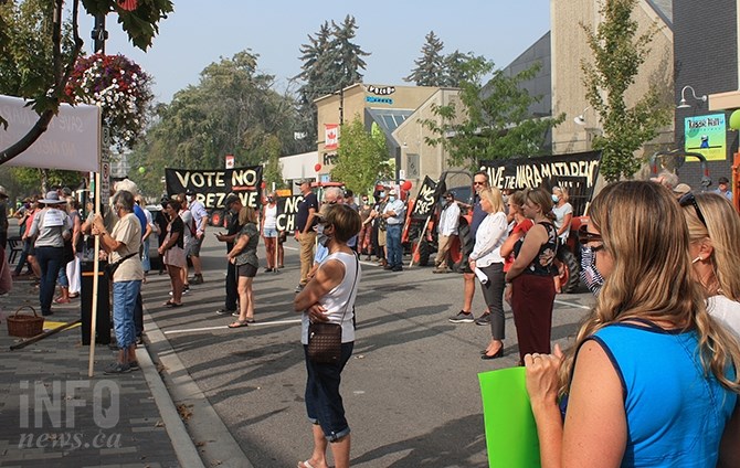 A crowd of around 100 people gathered to oppose a proposed 350 unit subdivision near Campbell Mountain in Penticton.
