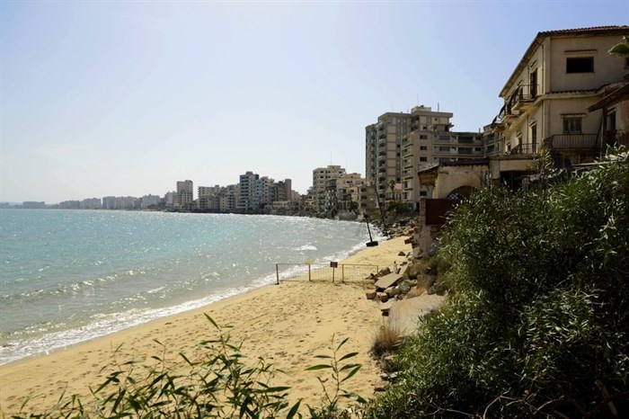 The beach with abandoned hotels seen after police open the beachfront of Varosha, an uninhabited, fenced-off suburb in war-divided Cyprus' in the Turkish occupied area in the breakaway Turkish Cypriot north on Thursday, Oct. 8, 2020. The United Nations and the European Union have expressed concern that Turkey's move to open the beachfront could hinder renewed efforts to reunify the island, split in 1974 when Turkey invaded following a coup by supporters of union with Greece.