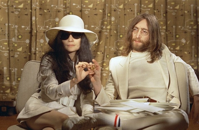 This 1969 photo shows musician John Lennon, right, and his wife Yoko Ono during a press conference. An album, 