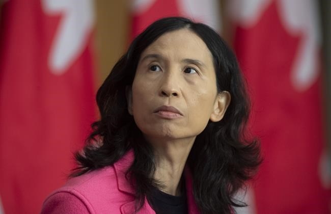 Chief Public Health Officer Theresa Tam looks at a slide projected on a screen during a news conference in Ottawa, Friday, Oct. 9, 2020.