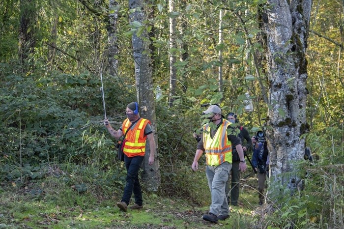 In photo provided by the Washington State Dept. of Agriculture, workers hold an antenna as they follow an Asian Giant Hornet wearing a tracking device, Thursday, Oct. 22, 2020 near Blaine, Wash. Scientists have discovered the first nest of so-called murder hornets in the United States and plan to wipe it out Saturday to protect native honeybees, officials in Washington state said Friday, Oct. 23, 2020. 