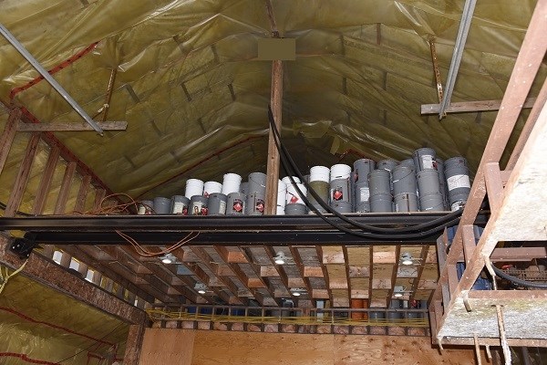 Stacks of acetone and toluene buckets in the rafters.