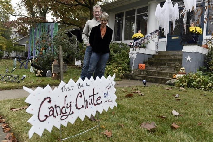 Carol McCarthy and her husband, Tom, pose for a portrait at their home they decorated for Halloween, Monday, Oct. 26, 2020, in Palmyra, N.J. 