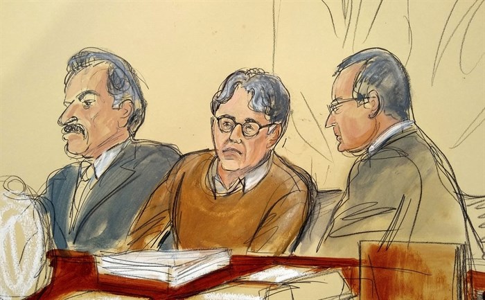 FILE - In this Tuesday, May 7, 2019, file courtroom drawing, defendant Keith Raniere, center, leader of the secretive group NXIVM, is seated between his attorneys Paul DerOhannesian, left, and Marc Agnifilo during the first day of his sex trafficking trial.
