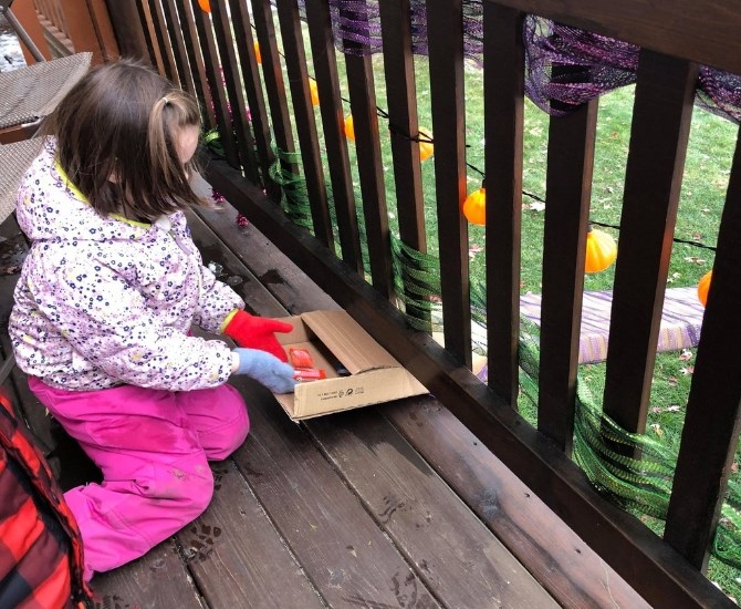 The kids put the candy in the chute opening from the deck, and the treats come out the bottom.