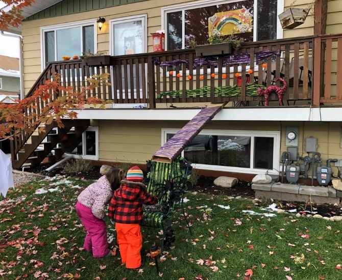 Cat Samson's family constructed a cardboard Halloween candy slide.