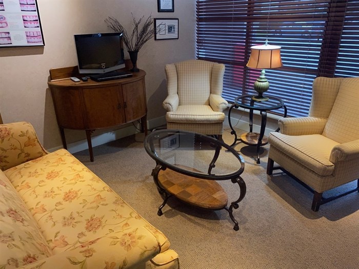 The waiting room in Dr. Ron Bentham’s dental practice is decorated more like a living room than a typical dental office waiting room to help patients feel more comfortable visiting the dentist.