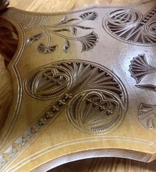 The tables show some fine craftsmanship and intricate carving.