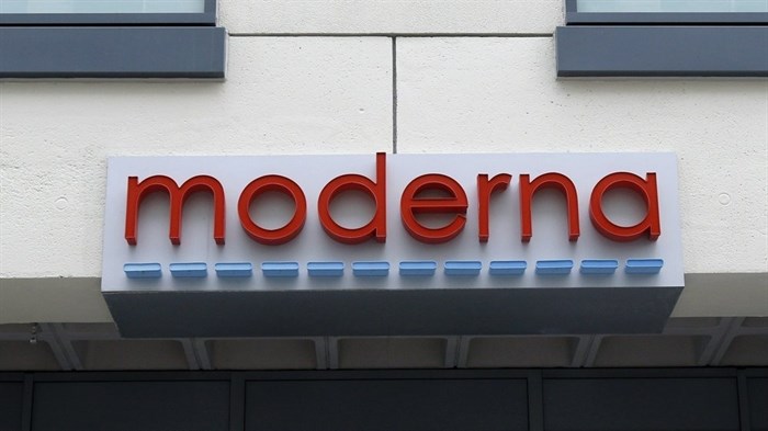 FILE - In this Monday, May 18, 2020, file photo, a sign marks an entrance to a Moderna, Inc., building, in Cambridge, Mass. Moderna said Monday, Nov. 16, 2020, its COVID-19 shot provides strong protection against the coronavirus that's surging in the U.S. and around the world.
