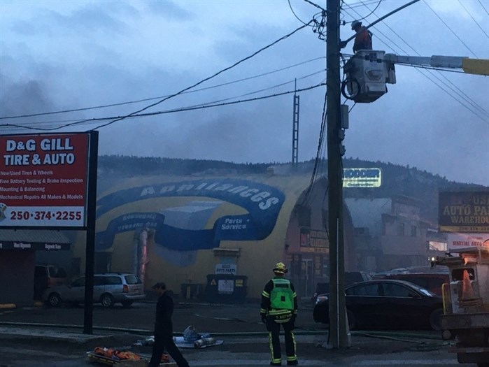Crews can be seen fighting a fire at a business on Mount Paul Way in Kamloops, Friday, Dec. 18, 2020.
