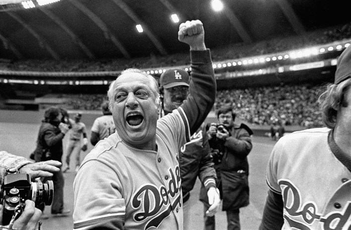 FILE - Los Angeles Dodgers manager Tom Lasorda celebrates after the Dodgers beat the Montreal Expos for the National League title in Montreal, in this Monday, Oct. 19, 1981, file photo. Tommy Lasorda, the fiery Hall of Fame manager who guided the Los Angeles Dodgers to two World Series titles and later became an ambassador for the sport he loved during his 71 years with the franchise, has died. He was 93. The Dodgers said Friday, Jan. 8, 2021, that he had a heart attack at his home in Fullerton, California.