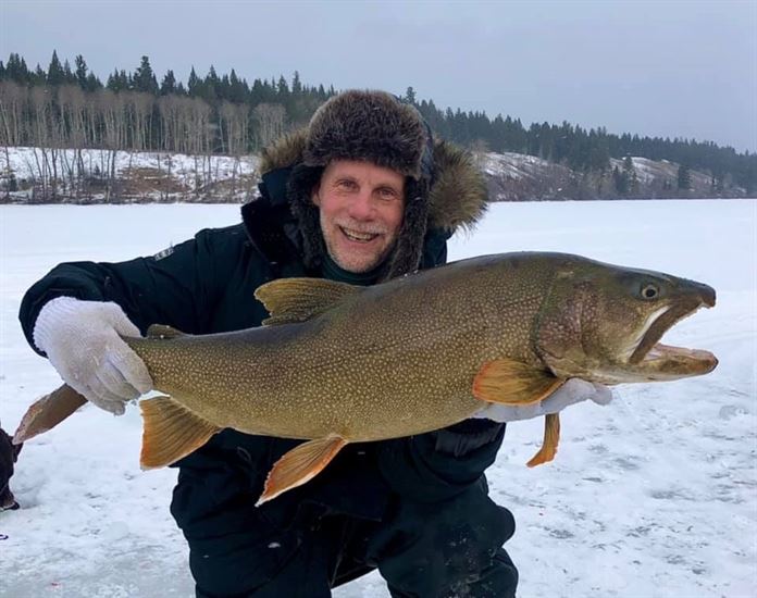 100 Mile House man catches massive 27-pound lake trout, iNFOnews