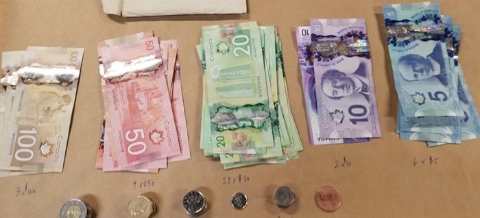 Along with drugs, police seized cash from a man sleeping behind the wheel of a parked car in Lake Country.