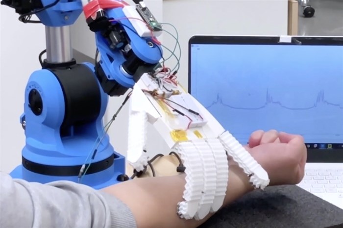 This robotic arm, built in SFU's Surrey campus, can measure heart rate, breathing, temperature and muscle movements.