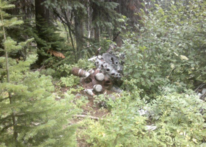 An engine from the downed Mitchell is slowly being consumed by the forest on Record Mountain, near Rossland.