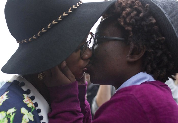 Tori Sisson, left, and Shante Wolfe kiss after saying their marriage vows, in Montgomery, Ala., Feb. 9, 2015. Sisson and Wolfe were the first same-sex couple to file their marriage license. The U.S. Supreme Court declared Friday, June 26, 2015, that same-sex couples have a right to marry anywhere in the country, in a culmination of two decades of litigation over marriage, and gay rights generally. 