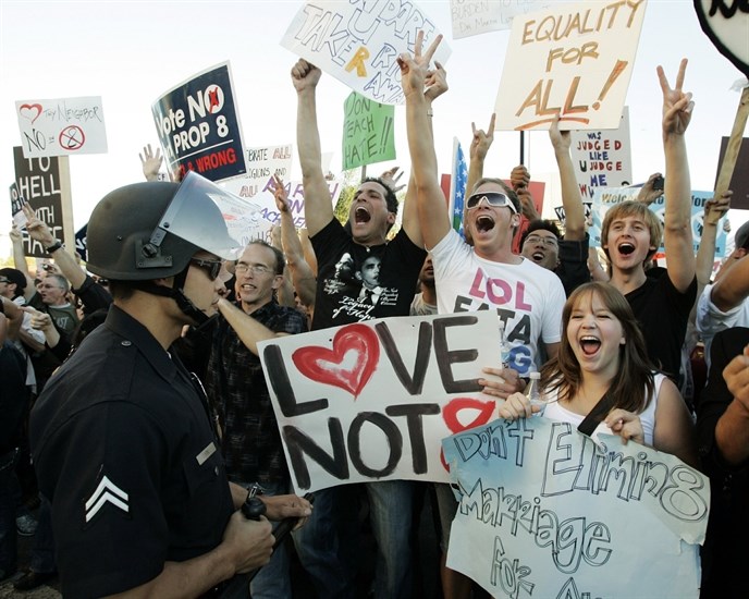 Protesters wait at a police skirmish line before being allowed to proceed as hundreds demonstrated against the Mormon Church's support of Proposition 8, the California ballot measure that banned same-sex marriage, in the Westwood district of Los Angeles Thursday, Nov. 6, 2008. Prop 8 was overturned in 2013.