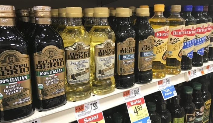 A variety of olive oils are displayed at a grocery store in Waterbury, Vt. on March 26, 2021.