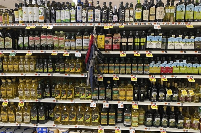A variety of olive oils are displayed at a grocery store in New Milford, Conn., on March 12, 2021. There is a lot of confusion about which olives oils to buy and how to use them.