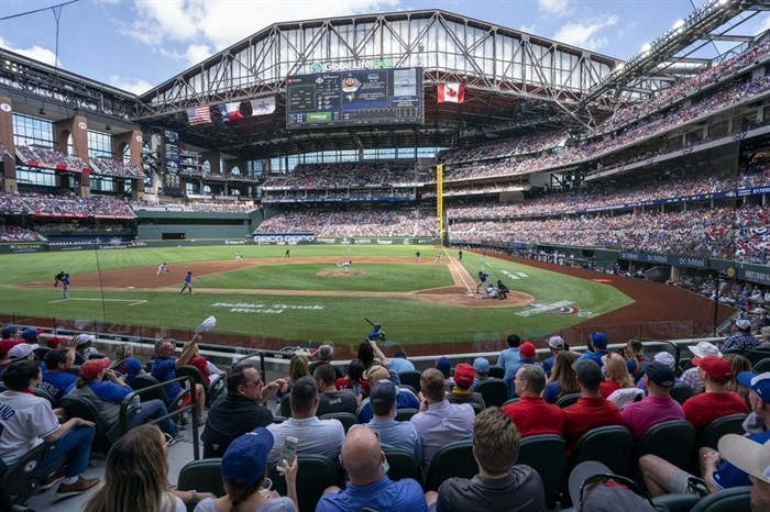 Fans fill the stands at Globe Life Field during the first inning of a baseball game between the Texas Rangers and the Toronto Blue Jays, Monday, April 5, 2021, in Arlington, Texas. The Rangers are set to have the closest thing to a full stadium in pro sports since the coronavirus shutdown more than a year ago.