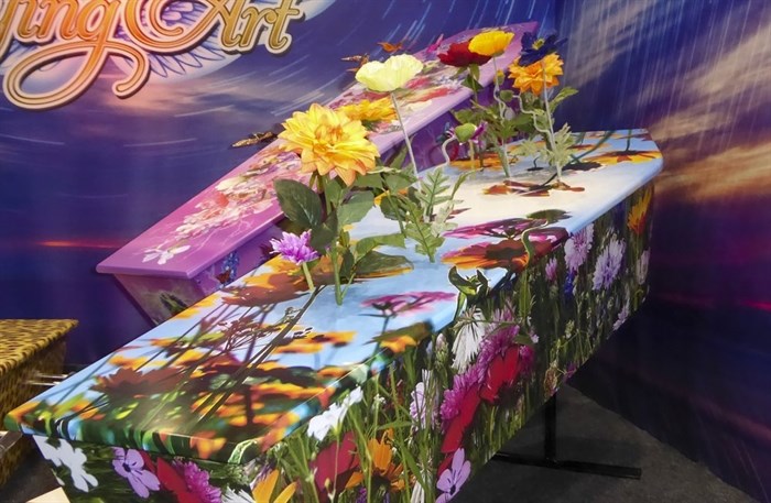 This photo provided by Ross Hall, shows floral designed caskets in Auckland, New Zealand March 17, 2016.