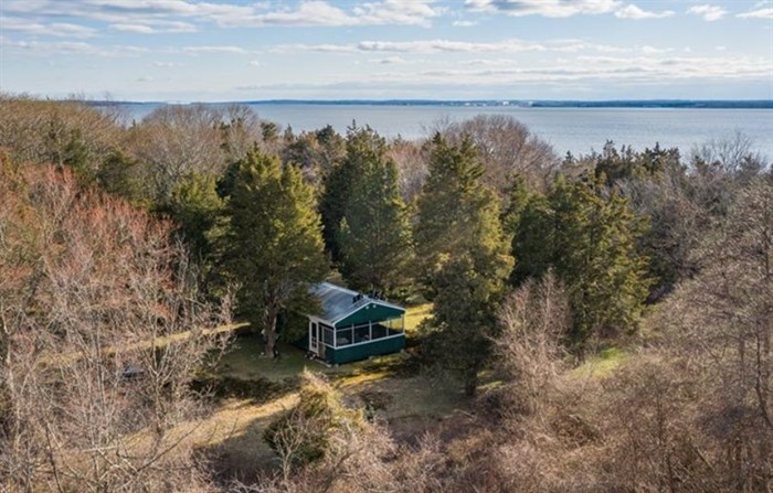 Zero patience for the company of others? Anyone who's ever wanted their own private island getaway now has a chance — and it might be less expensive than you'd think. The only house on a small island in Rhode Island's Narragansett Bay — with the unique address of 0 Patience Way — has hit the market for an asking price of $399,900.