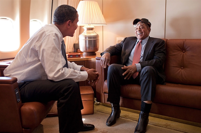 President Barack Obama talks with baseball great Willie Mays aboard Air Force One en route to the 2009 MLB All-Star Game in St. Louis, July 14, 2009.