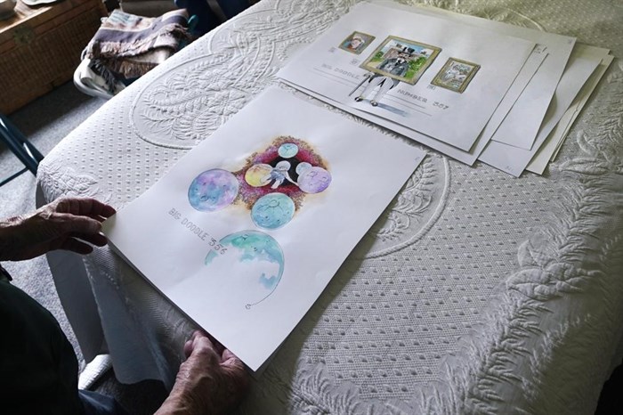 Artist Robert Seaman reviews recent completed doodles in his room at an assisted living facility Monday, May 10, 2021, in Westmoreland, N.H. Seaman, who moved into the facility weeks before the COVID-19 pandemic shutdown his outside world in 2020, recently completed his 365th daily sketch, or what he calls his 