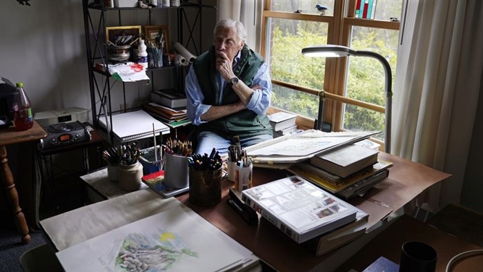 Artist Robert Seaman pauses while sketching in his room at an assisted living facility Monday, May 10, 2021, in Westmoreland, N.H. Seaman, who moved into the facility weeks before the COVID-19 pandemic shutdown his outside world in 2020, recently completed his 365th daily sketch, or what he calls his 