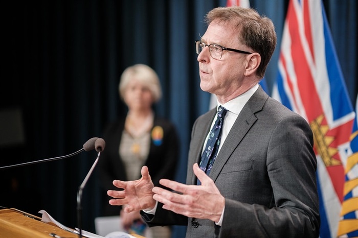 FILE PHOTO - B.C. Health Minister Adrian Dix speaks to reporters during a COVID-19 update, May 10, 2021, as provincial health minister Dr. Bonnie Henry looks on.