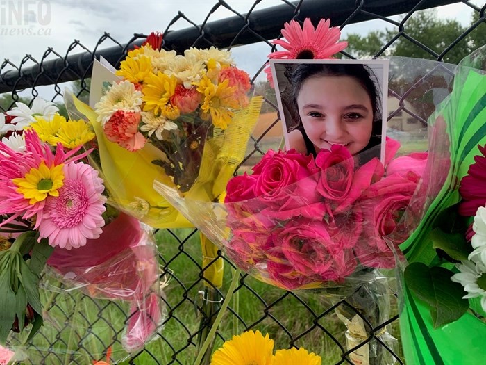 A memorial has been set up at the intersection of Gordon Drive and Cook Road after three Kelowna students died in a car accident, May 26, 2021.