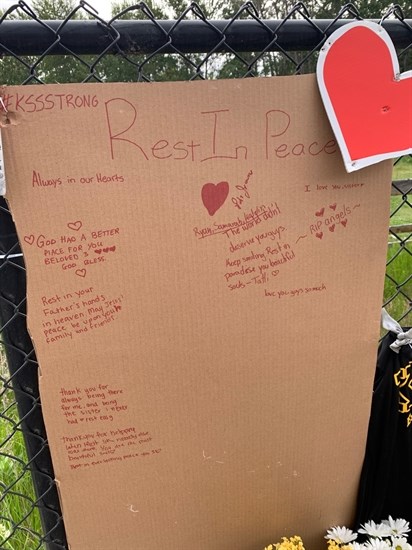 A memorial has been set up at the intersection of Gordon Drive and Cook Road after three Kelowna students died in a car accident, May 26, 2021.