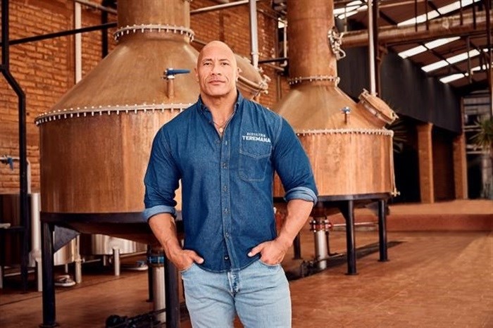 This photo provided by Jesus Maria shows Dwayne Johnson, co-founder of Teremana Tequila at the Teremana tequila distillery in Jalisco, Mexico. Johnson joins a list of celebrities including George Clooney, Nick Jonas and Kendall Jenner with their own tequila brands.