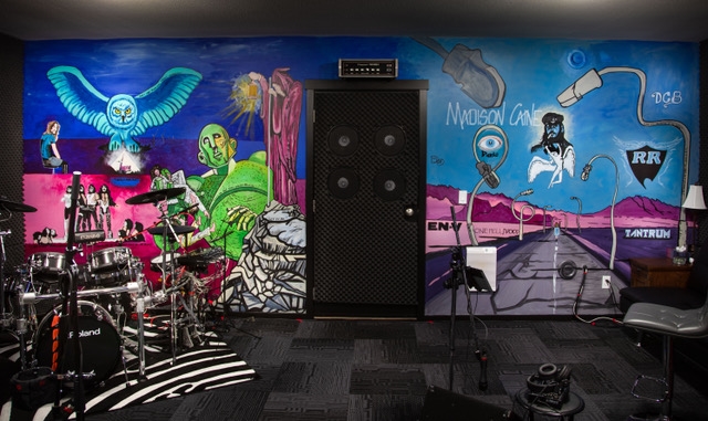 This Kamloops rock music themed mural was painted by Stace DeWolf.  It took him 80 hours to complete.
