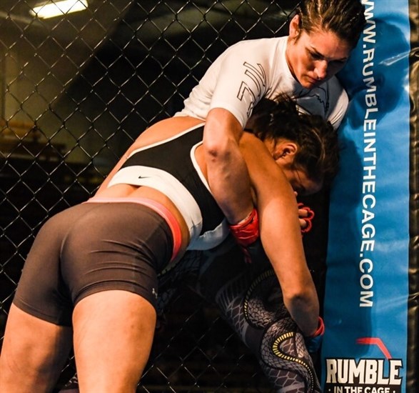 Rylie “Coyote” Marchand pictured here in a hold says she feels most at peace while in the ring.