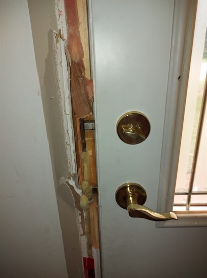 The suspect broke into Bev Rogers' front door on the morning of July 28, 2021, leaving behind damage to the door and its frame.