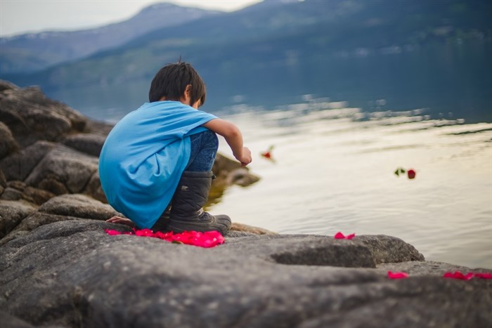 kilawna Marchand, my youngest son, sends off prayers to the water at Okanagan Lake in his own way.